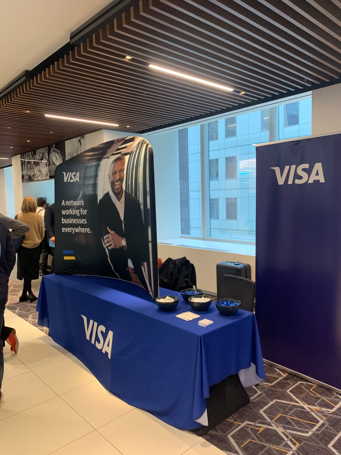 Visa activation table and pull-up banner in the summit foyer