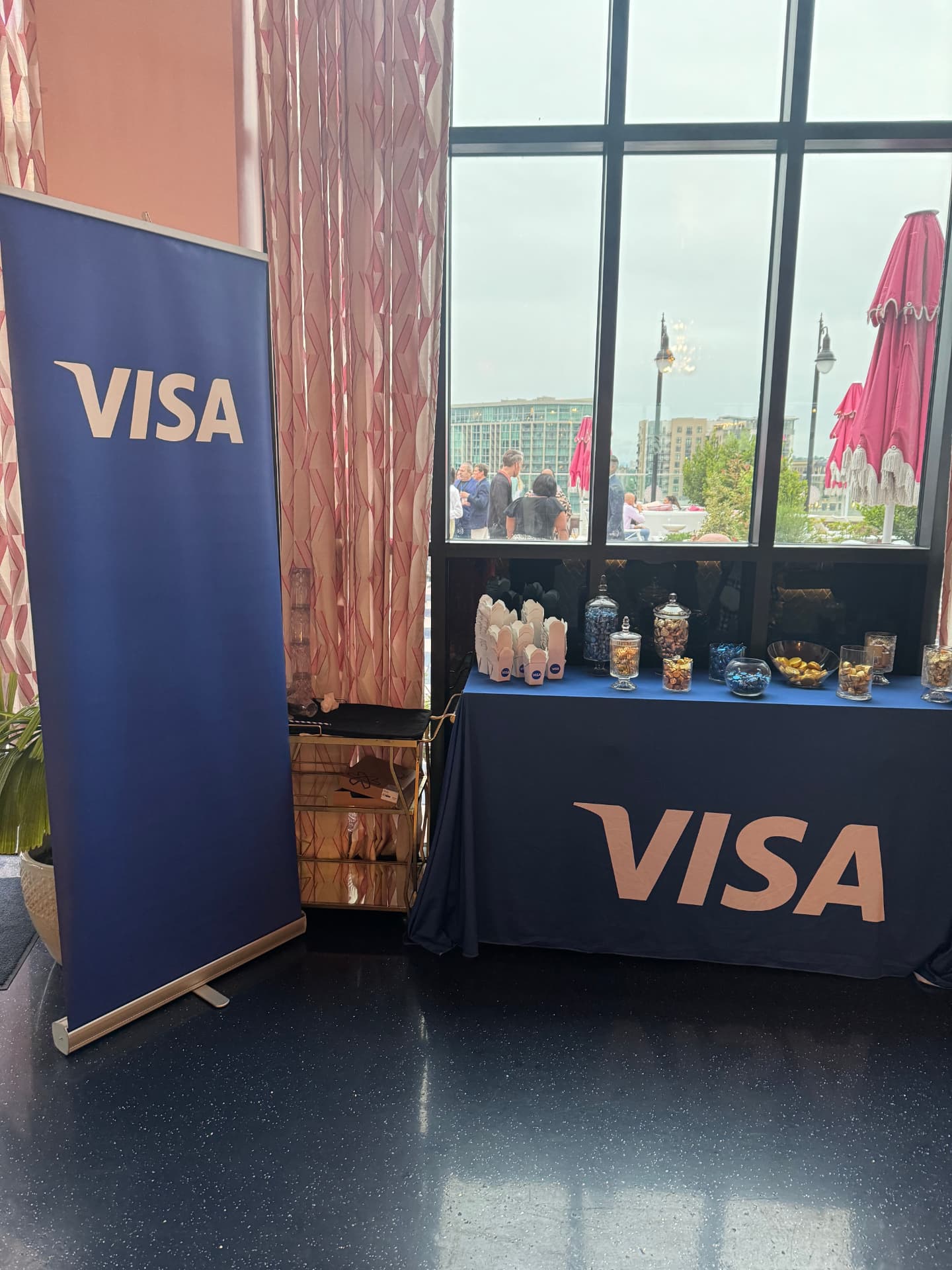 Visa pull-up banner beside the branded candy table at the reception