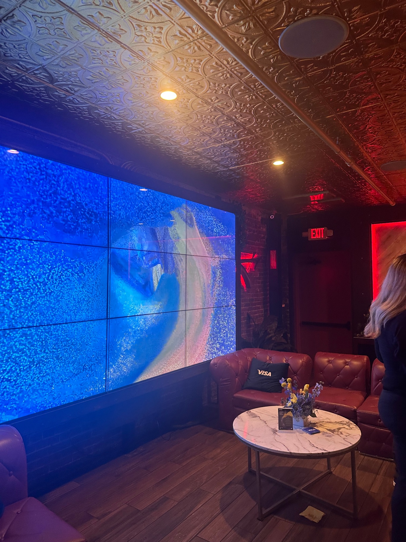 Visa branded video wall and lounge at the evening reception