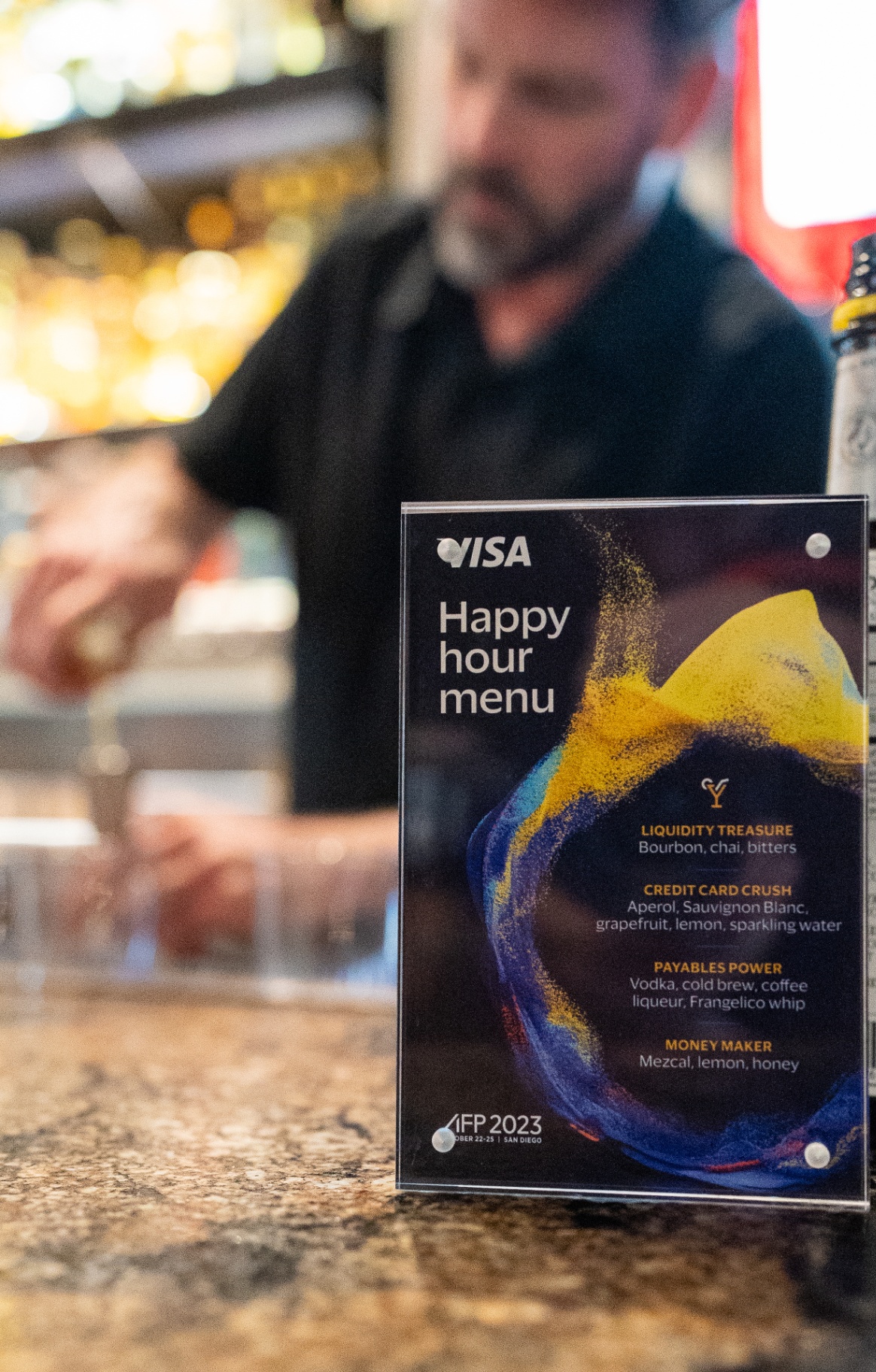Visa Happy Hour menu on the bar at AFP 2023 in San Diego