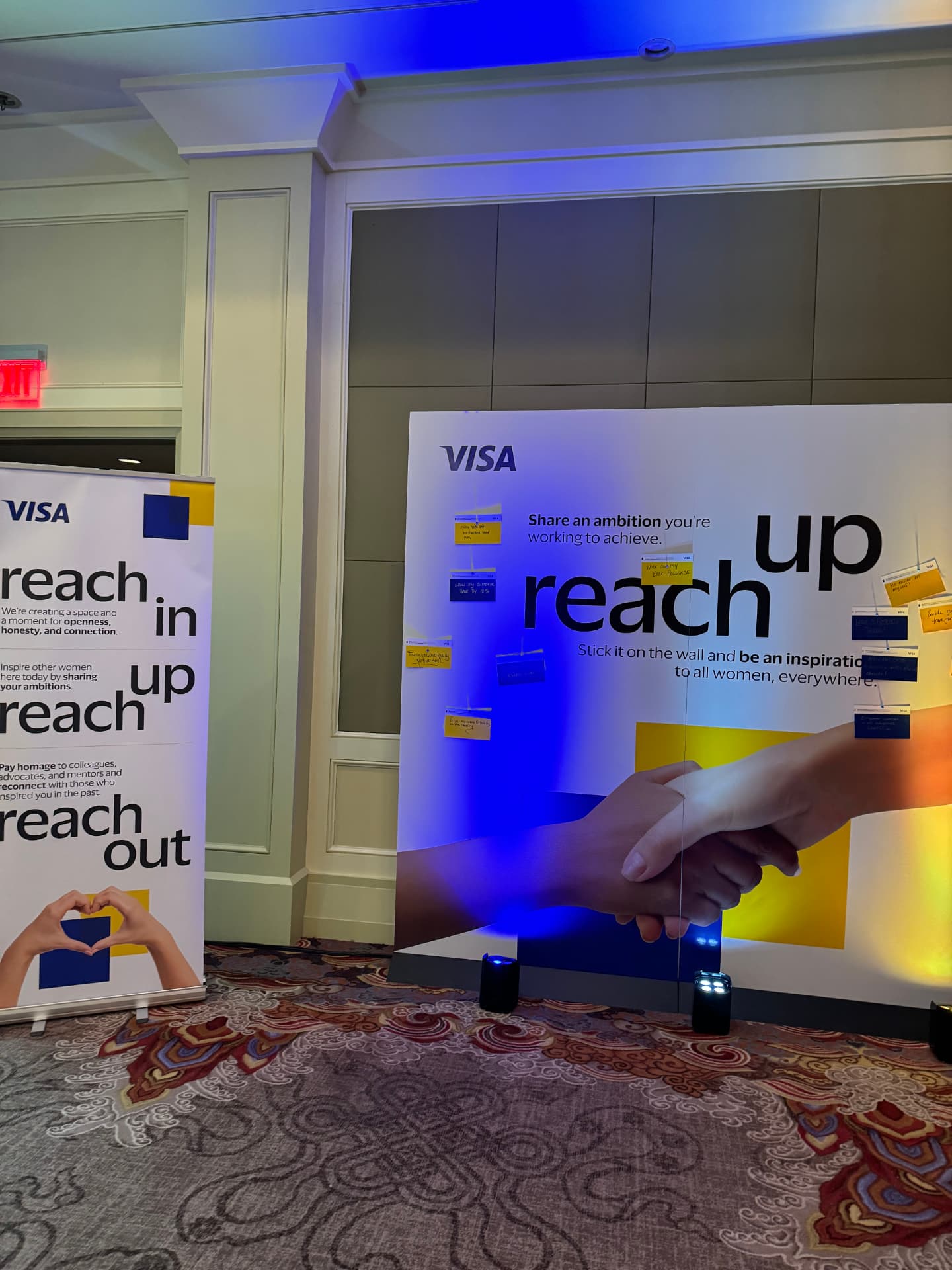 reach up ambition wall beside the Visa reach in banner