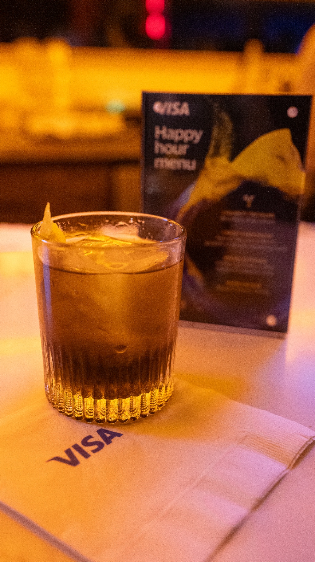 Visa signature cocktail served on a branded napkin