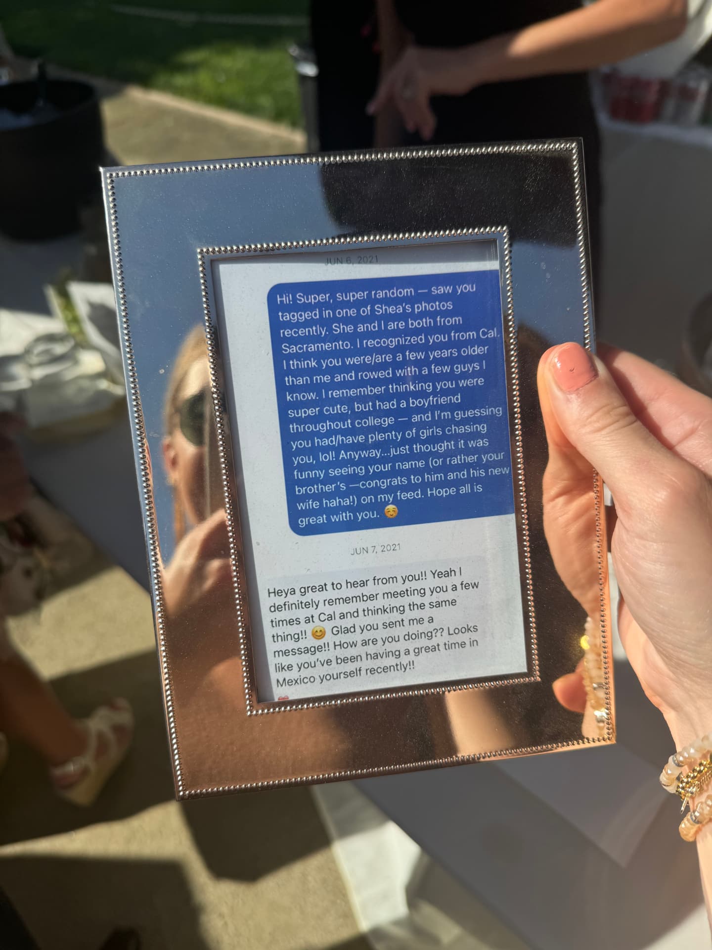 Framed first-message keepsake displayed as part of the couple's story installation