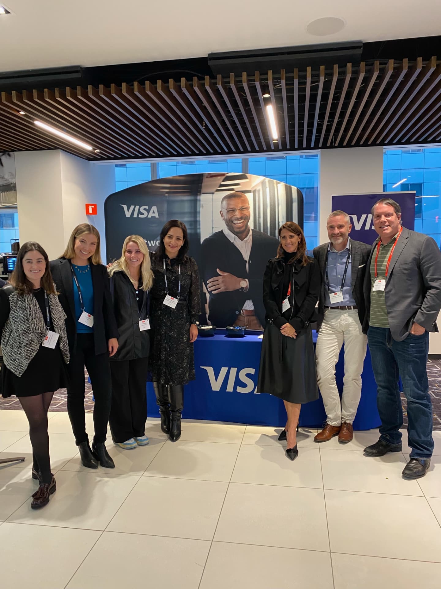 Group photo of the Visa team at the summit welcome booth